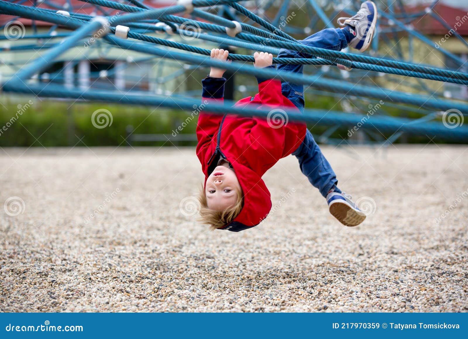 cute toddler boy, playing on the playground