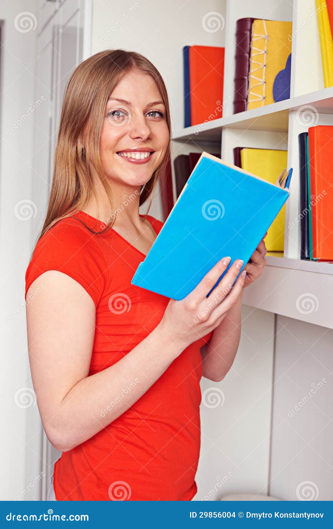 Woman Holding Book and Looking at Camera Stock Photo Image of book