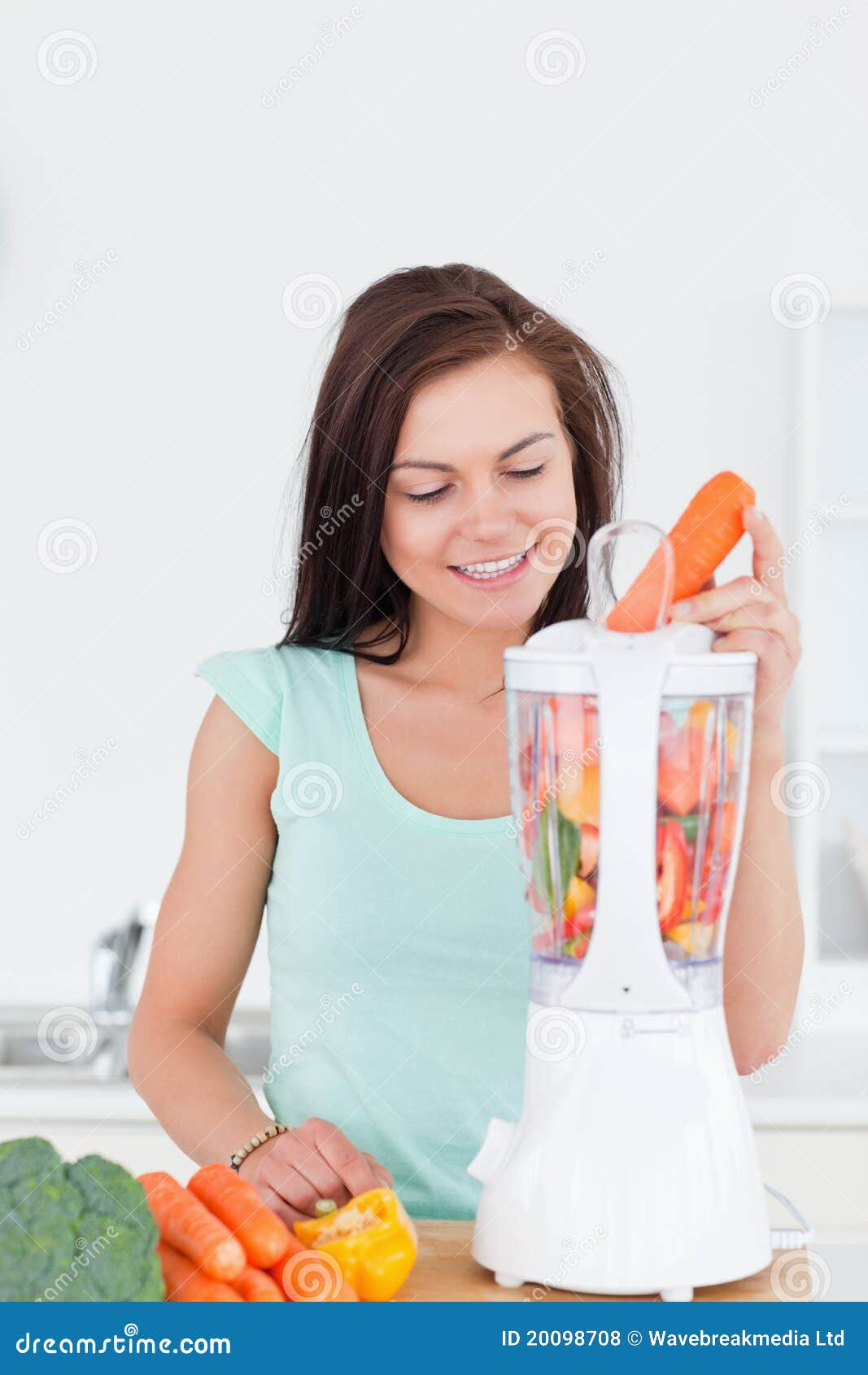 Cute woman using a blender stock photo. Image of home 20098708