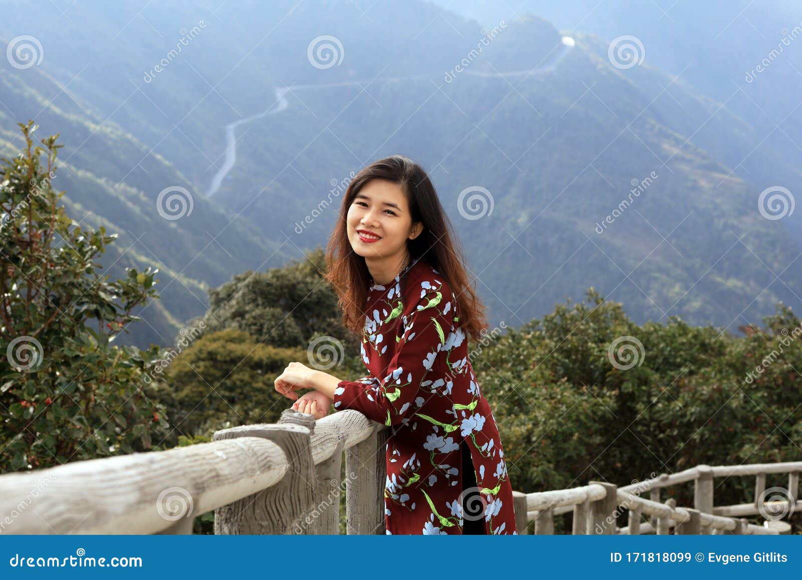 Cute Young Asian Woman with High Mountains Landscape on the