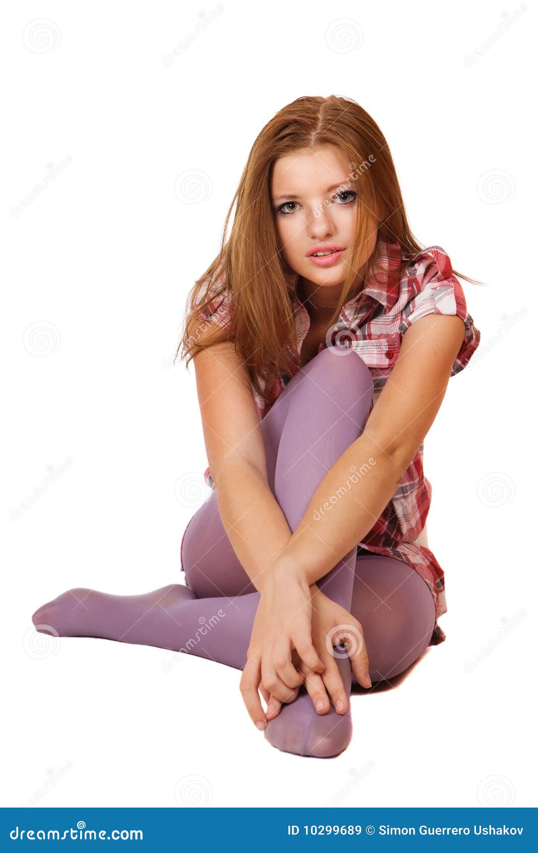 Smiling young girl practicing yoga sitting in lotus pose, meditating in cozy  home interior. Female training for wellness Stock Photo - Alamy