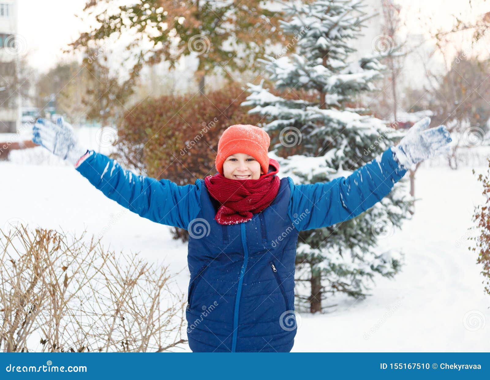 Cute Young Boy in Hat Blue Jacket Holds and Plays with Snow, Has Fun ...