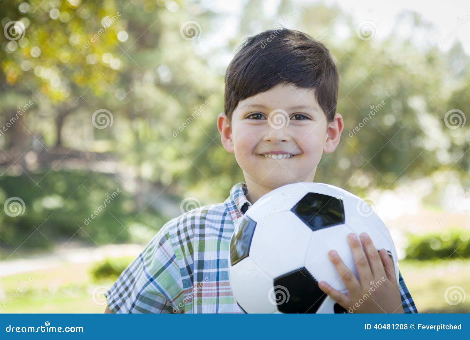 Cute Young Boy Playing With Soccer Ball In Park Stock Photo Image of