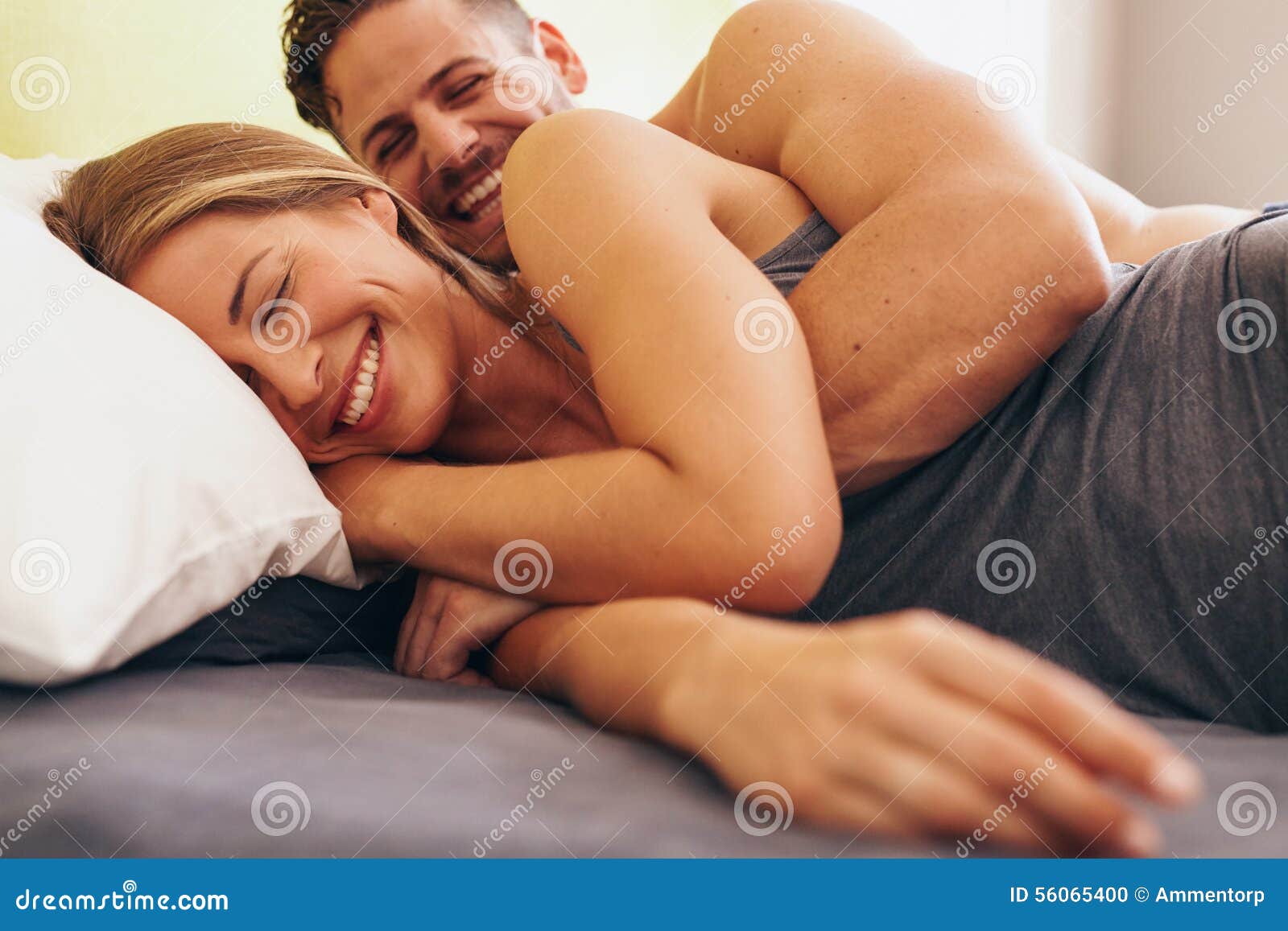 https://thumbs.dreamstime.com/z/cute-young-couple-love-lying-bed-image-man-waking-up-his-wife-morning-56065400.jpg