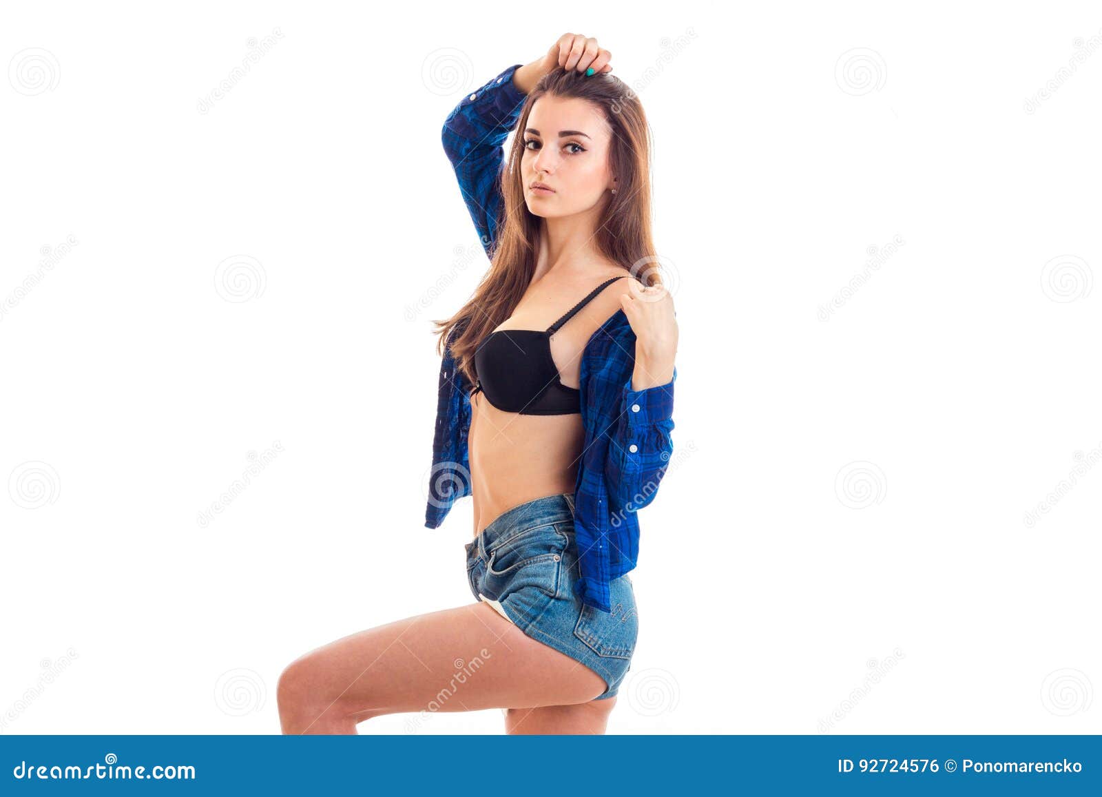 Woman Takes Off Her Shirt And Shows Her Bra Stock Photo, Picture