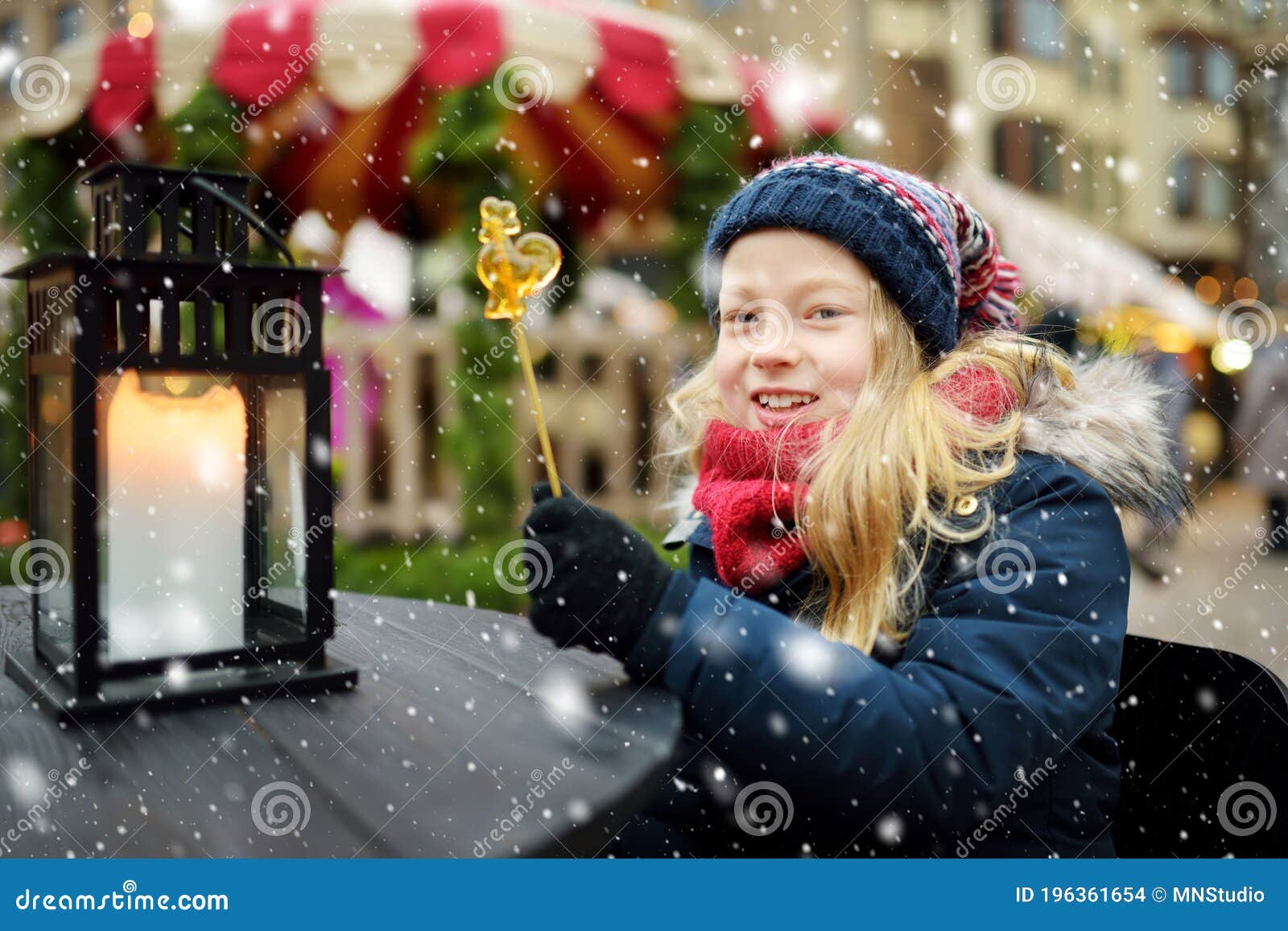 Cute Young Girl Having Rooster-shaped Lollipop on Traditional Christmas ...