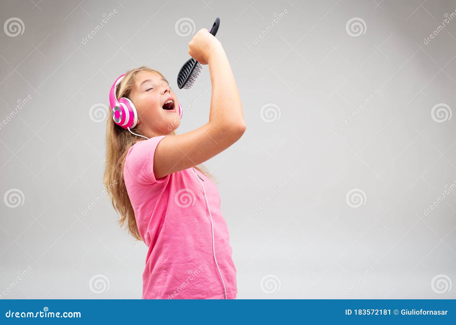 Cute Young Girl Singing Along To Her Music Stock Image Image Of