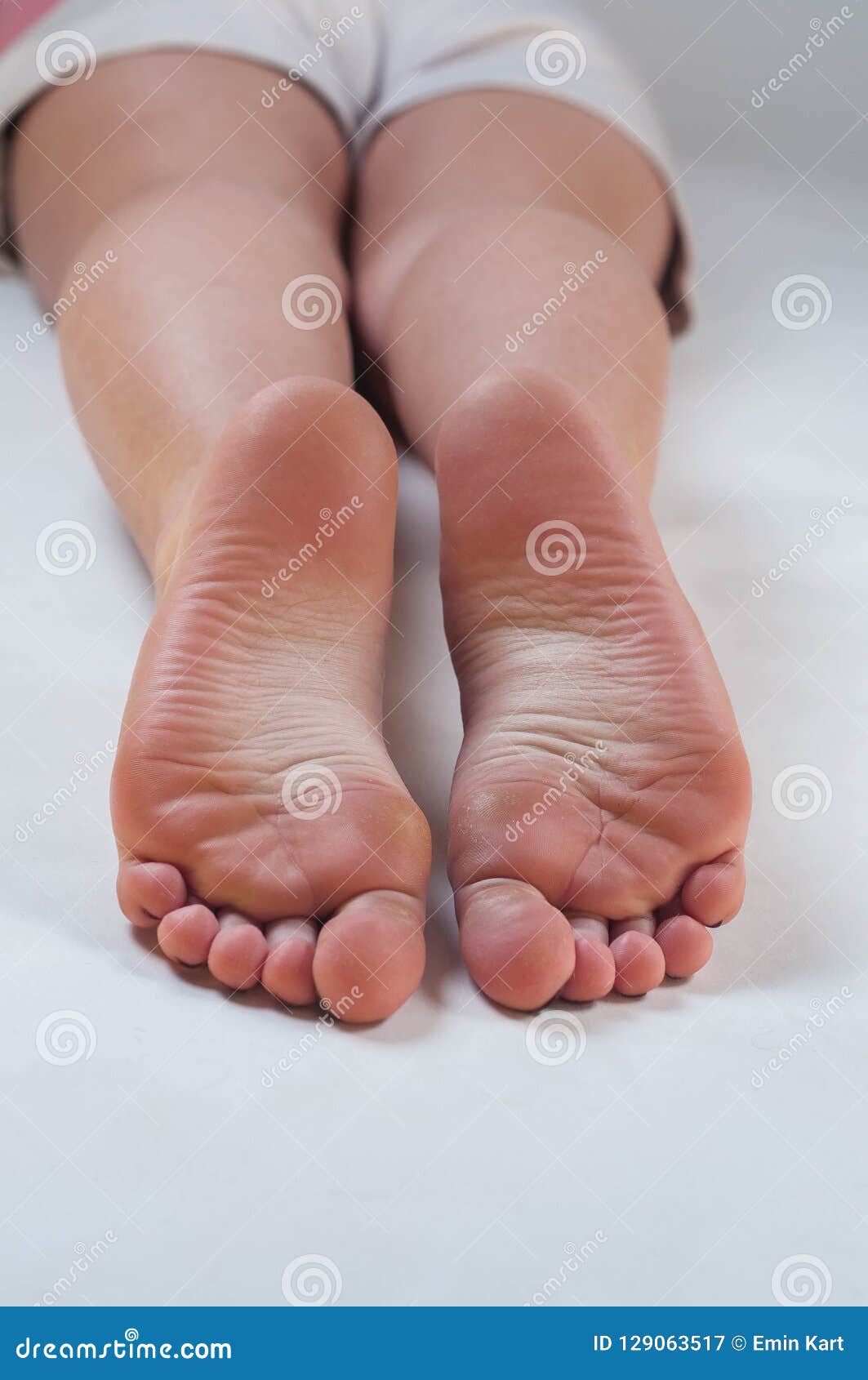 Cute young girl soles feet stock image 