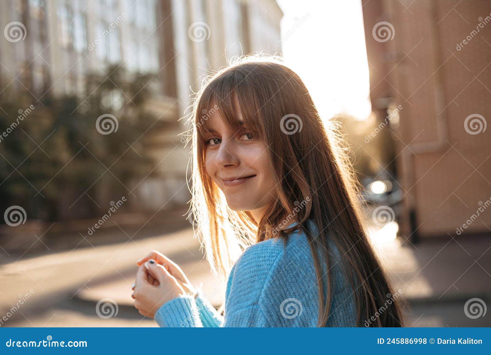 Cute Young Woman with Long Blonde Hair and Fringe Hairstyle Stock Photo