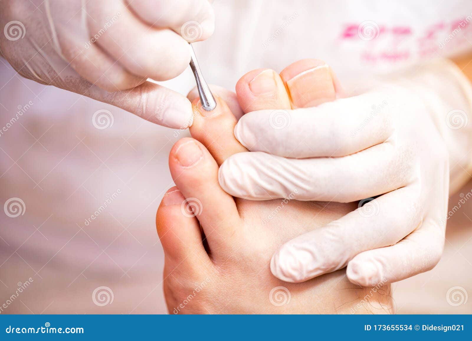 cuticle treatment for pretty and clean toenails, menÃ¢â¬â¢s pedicure toenail concept