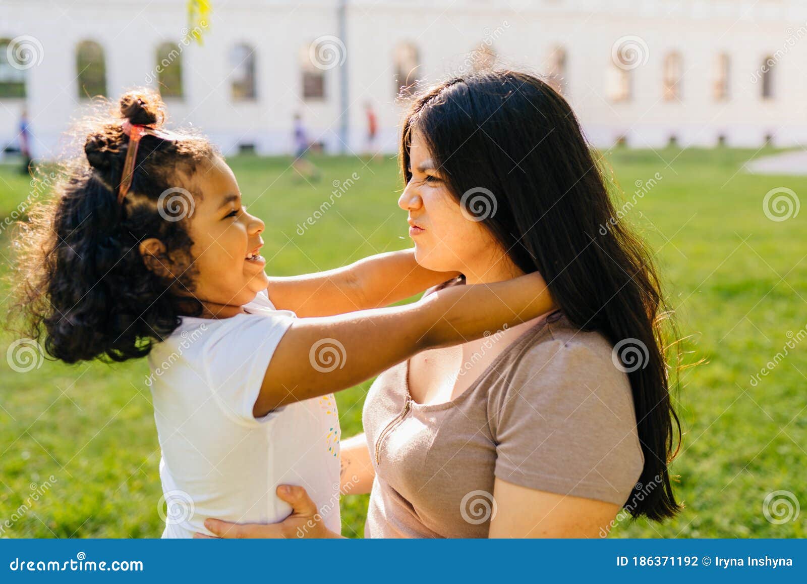 Cutie Curly Mexican Dark Skinned Preschooler Girl Playing, Hugging Her  Latin Mother Outdoor in European City Park Stock Photo - Image of caress,  smiling: 186371192