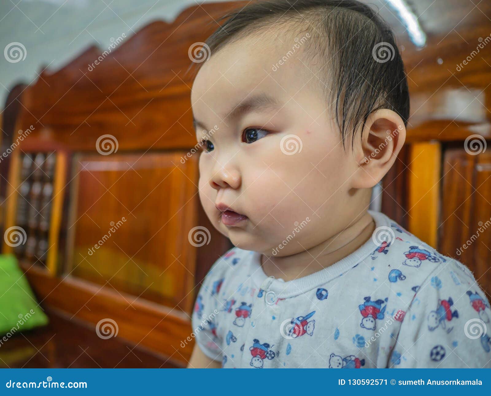 Cutie and Handsome Asian Boy Baby or Infant Make a Face Like Interested ...