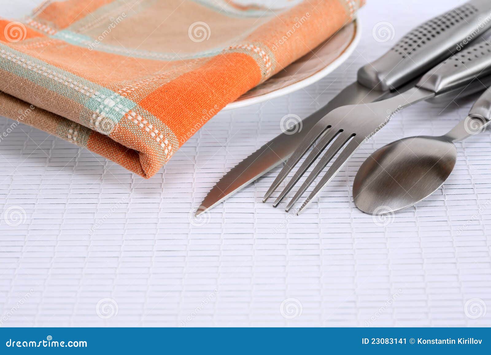 Cutlery and Napkin stock image. Image of setting, fork 23083141