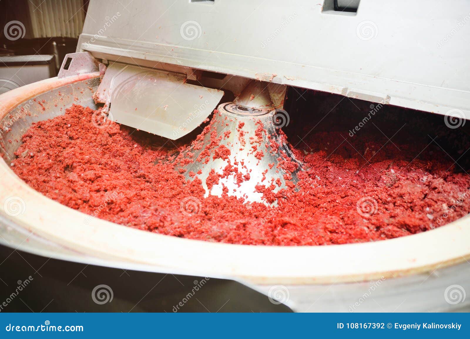 Processing of Meat in the Food Industry on a Cutter Stock Photo Image