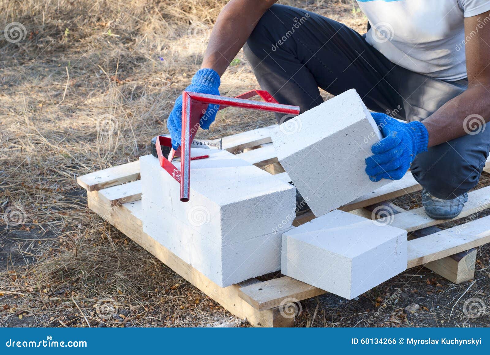 Cutting aerated concrete stock photo. Image of block - 60134266