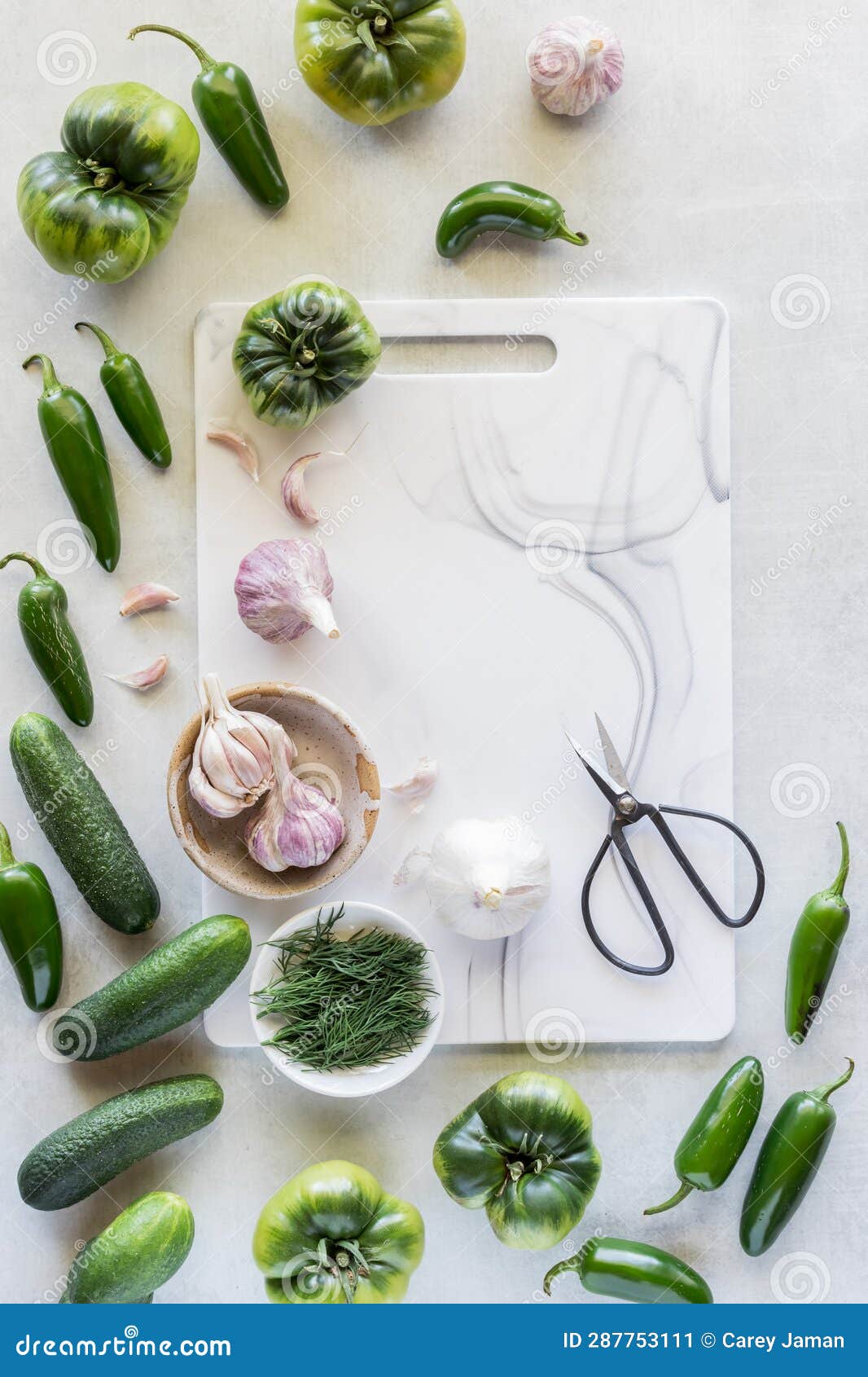 A Cutting Board Surrounded by Green Fruit, Vegetables and Garlic. Stock Image Image of