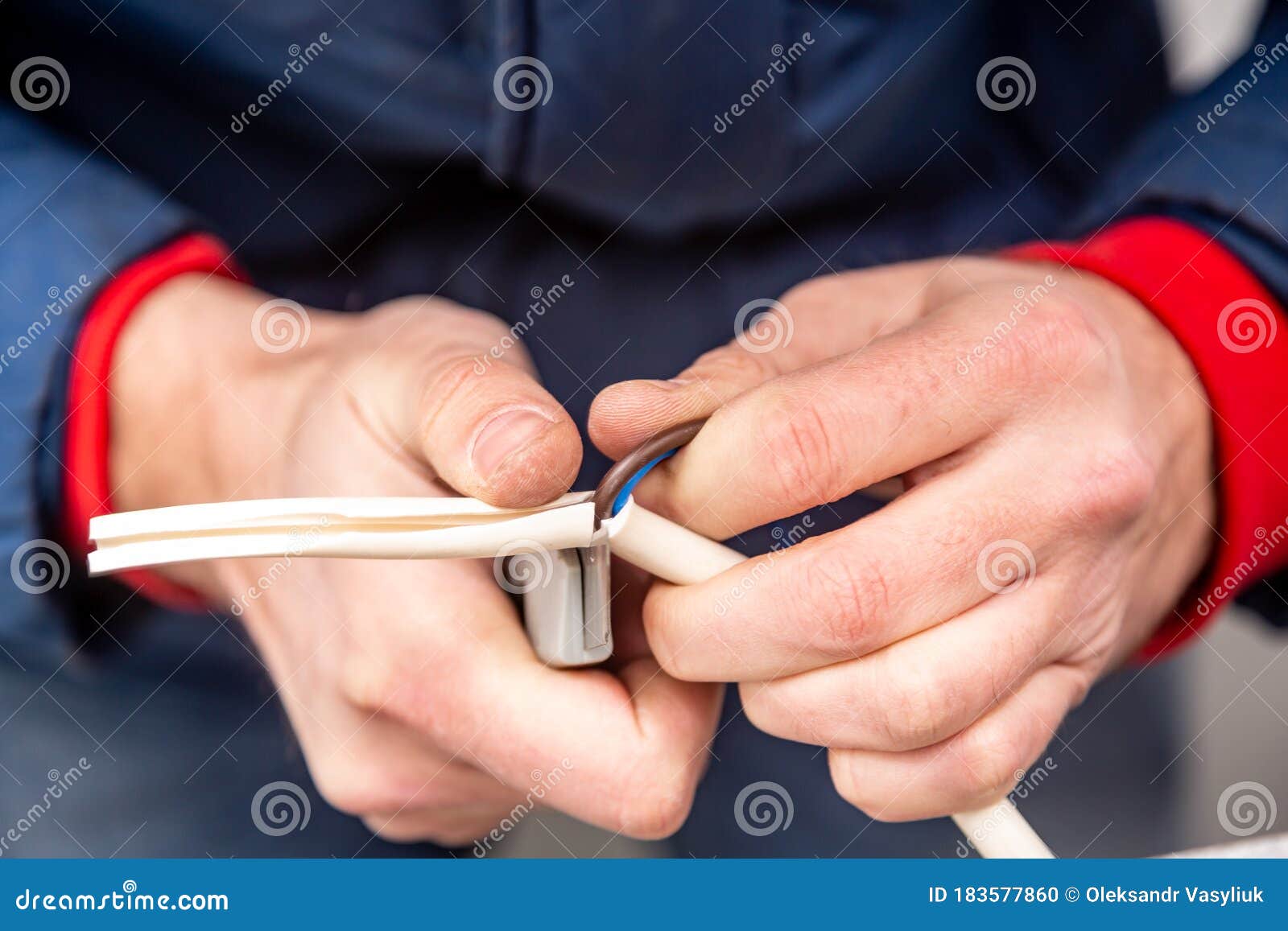 Cutting Cable Insulation with a Segmented Knife. White Cable, Yellow