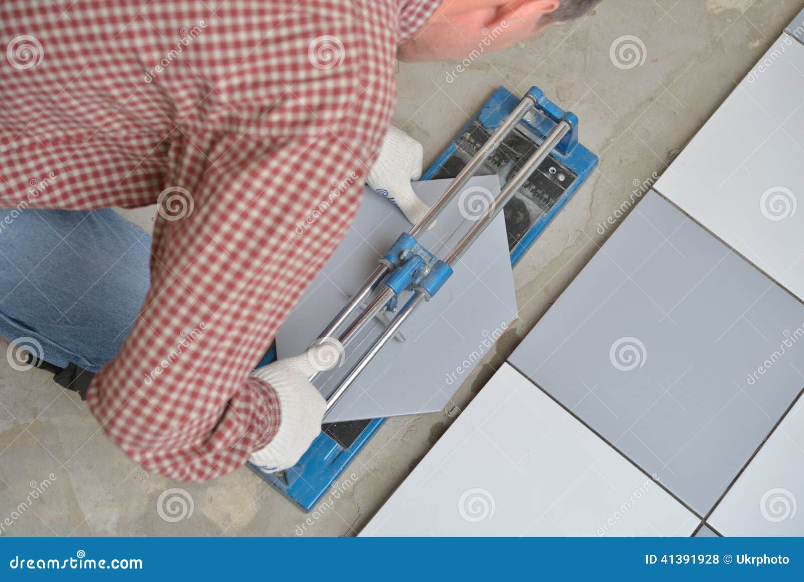 Cutting ceramic tiles stock photo. Image of renovation 41391928