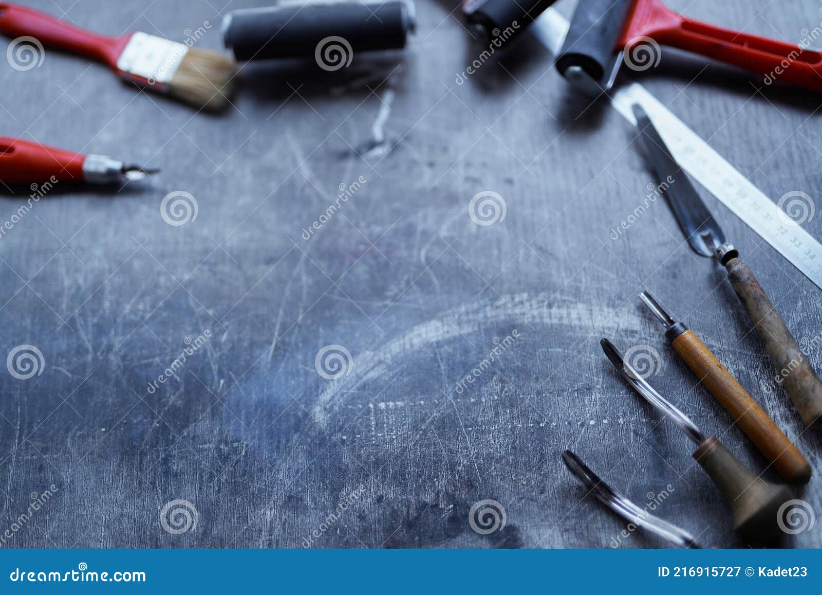 Set of Linocut Tools on a Dark Table with Copy Space Stock Image