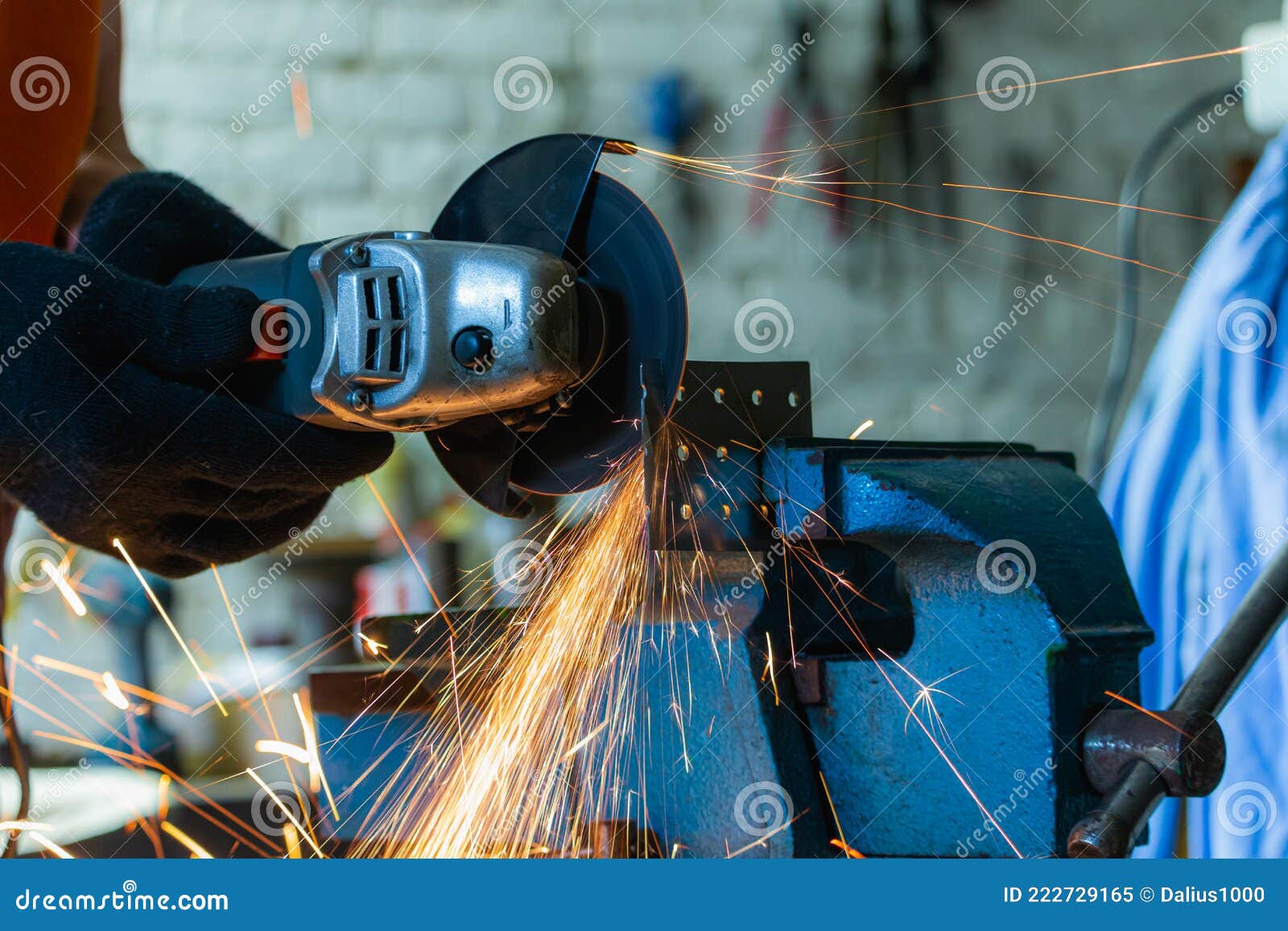 Cutting Metal with an Angle Grinder. Metal Particles Flying Stock Image