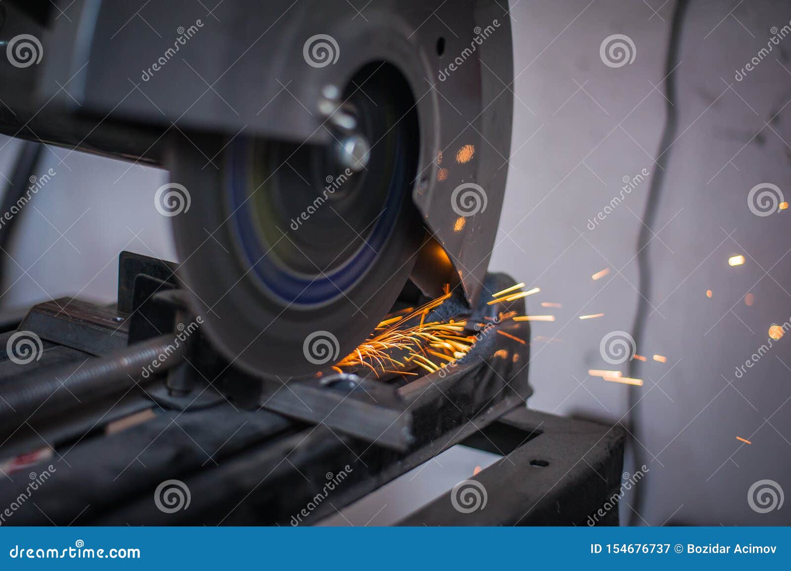 Cutting Metal with Grinder in Sparks while Grinding Iron