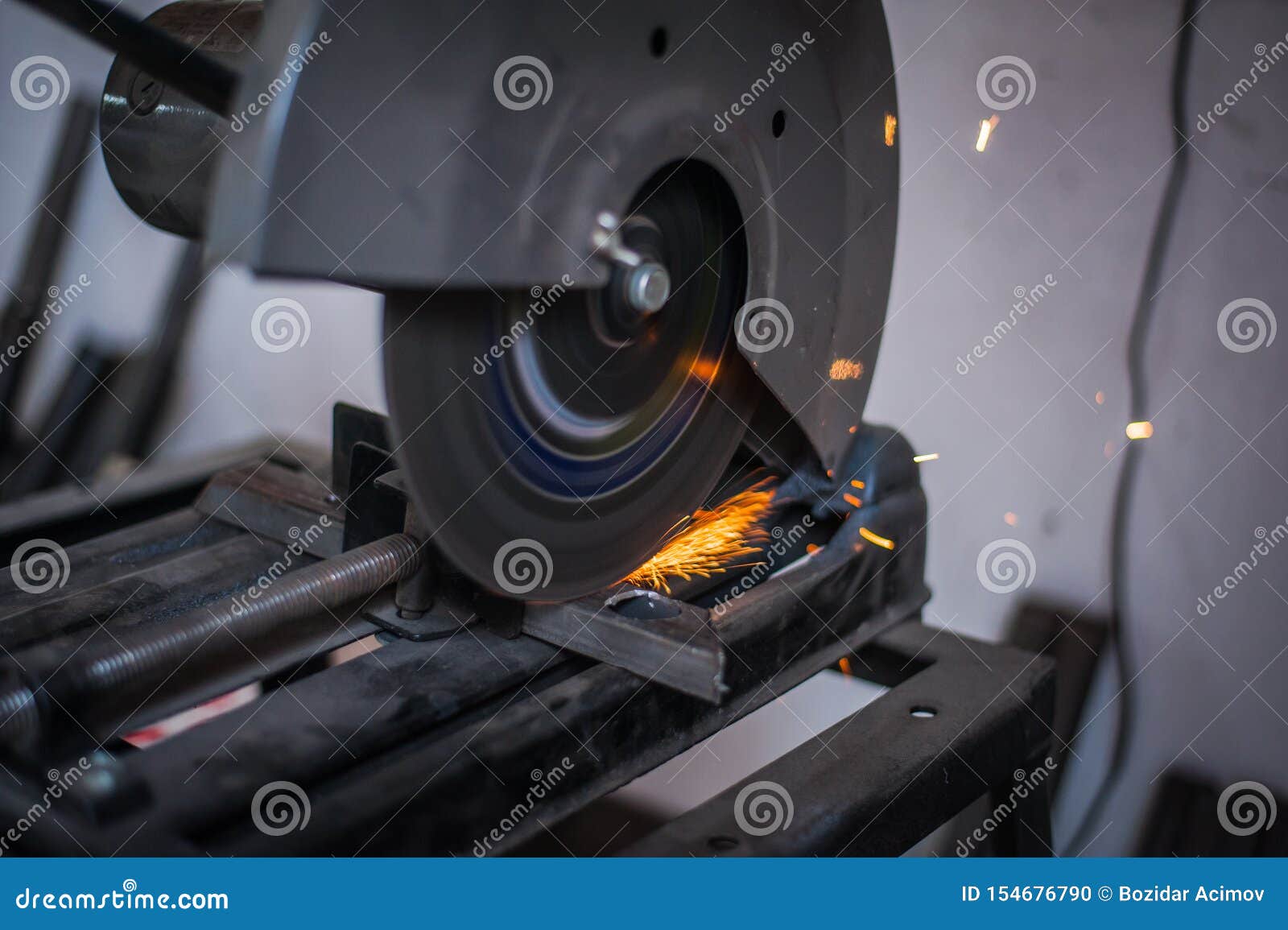 Cutting Metal with Grinder in Sparks while Grinding Iron