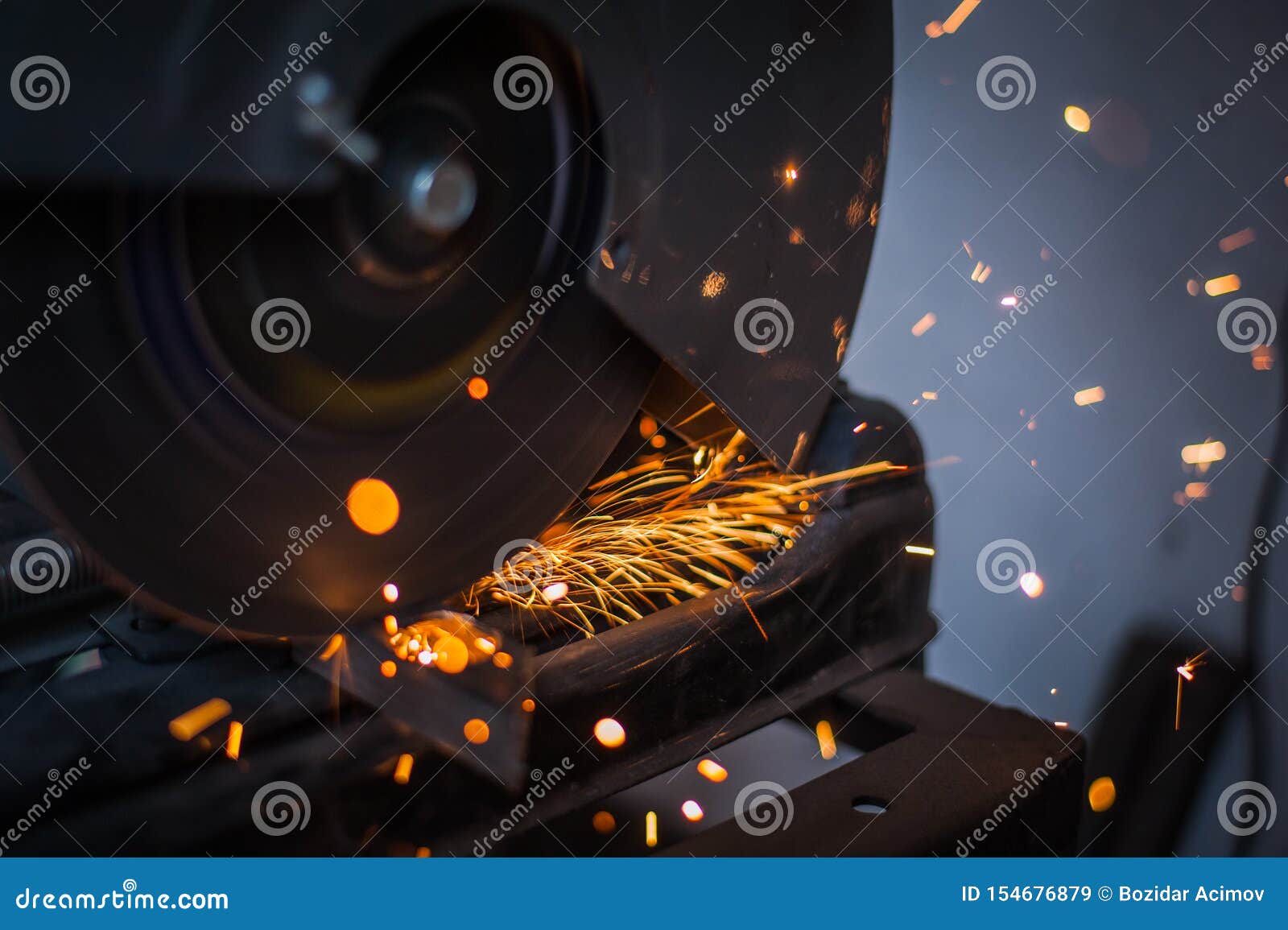 Cutting Metal with Grinder in Sparks while Grinding Iron