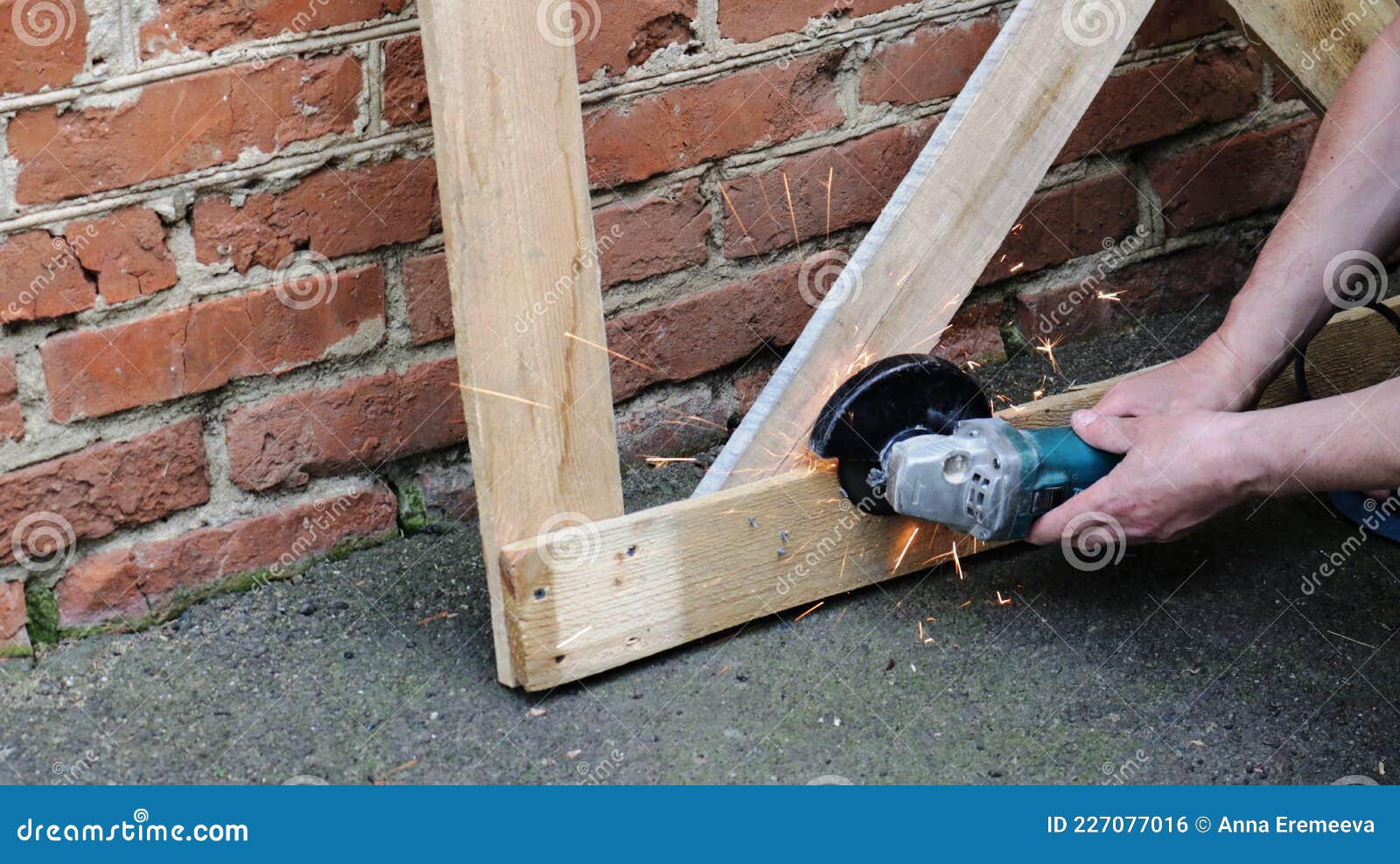 Cutting Nails with a Grinder in the Structure of a Wooden Frame Stock