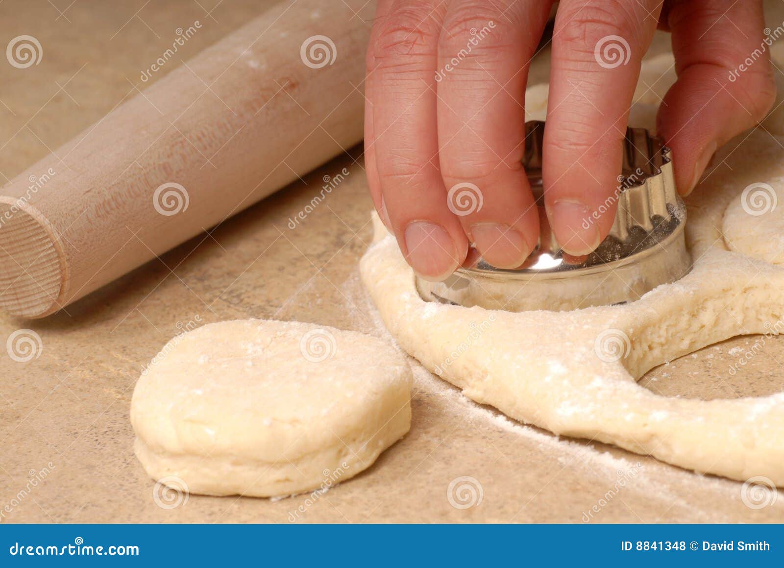 cutting out buttermilk biscuit dough