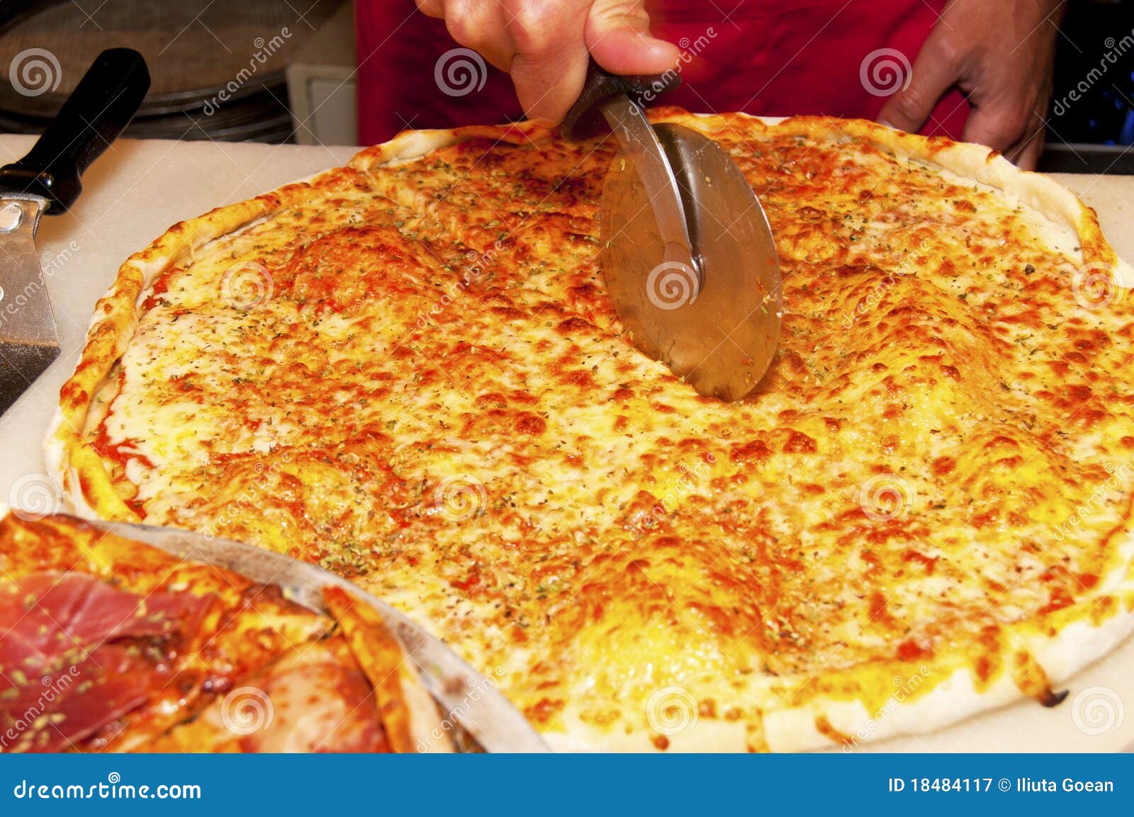 Cutting Pizza in Slices stock image. Image of food, italian 18484117