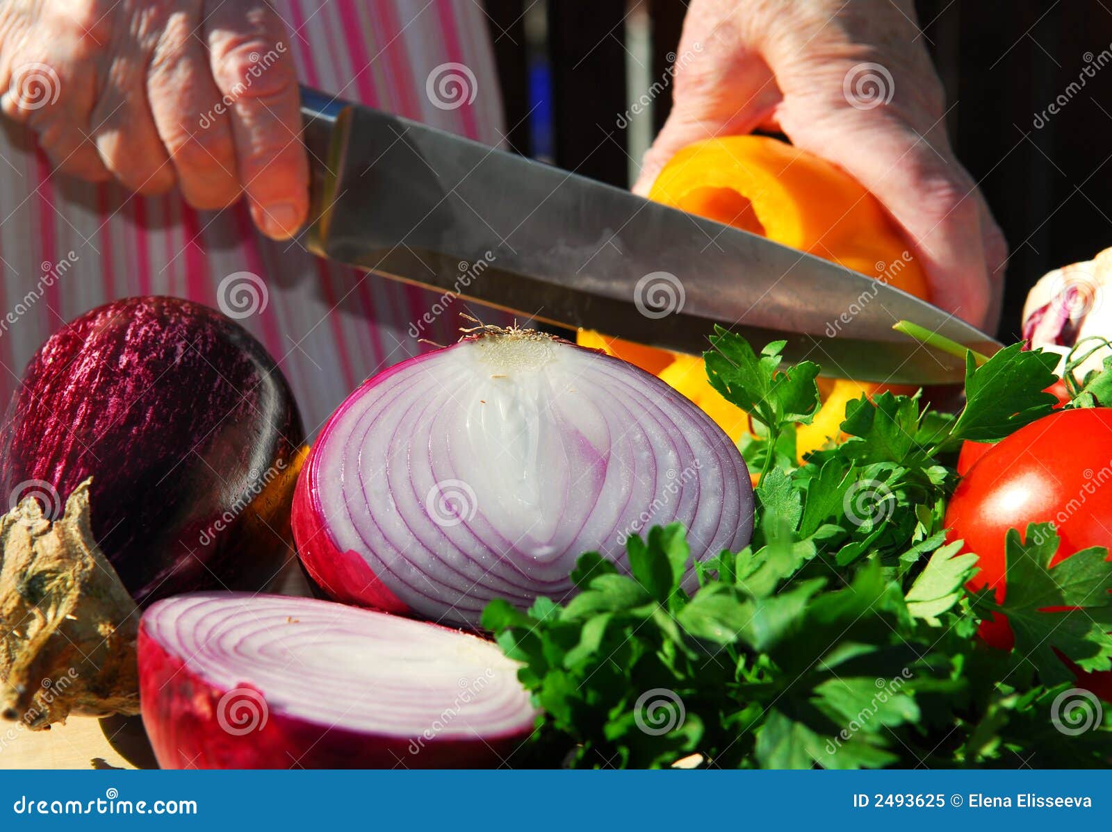 Chef cuts up meat on a cutting board with a sharp knife Stock Photo by  wirestock