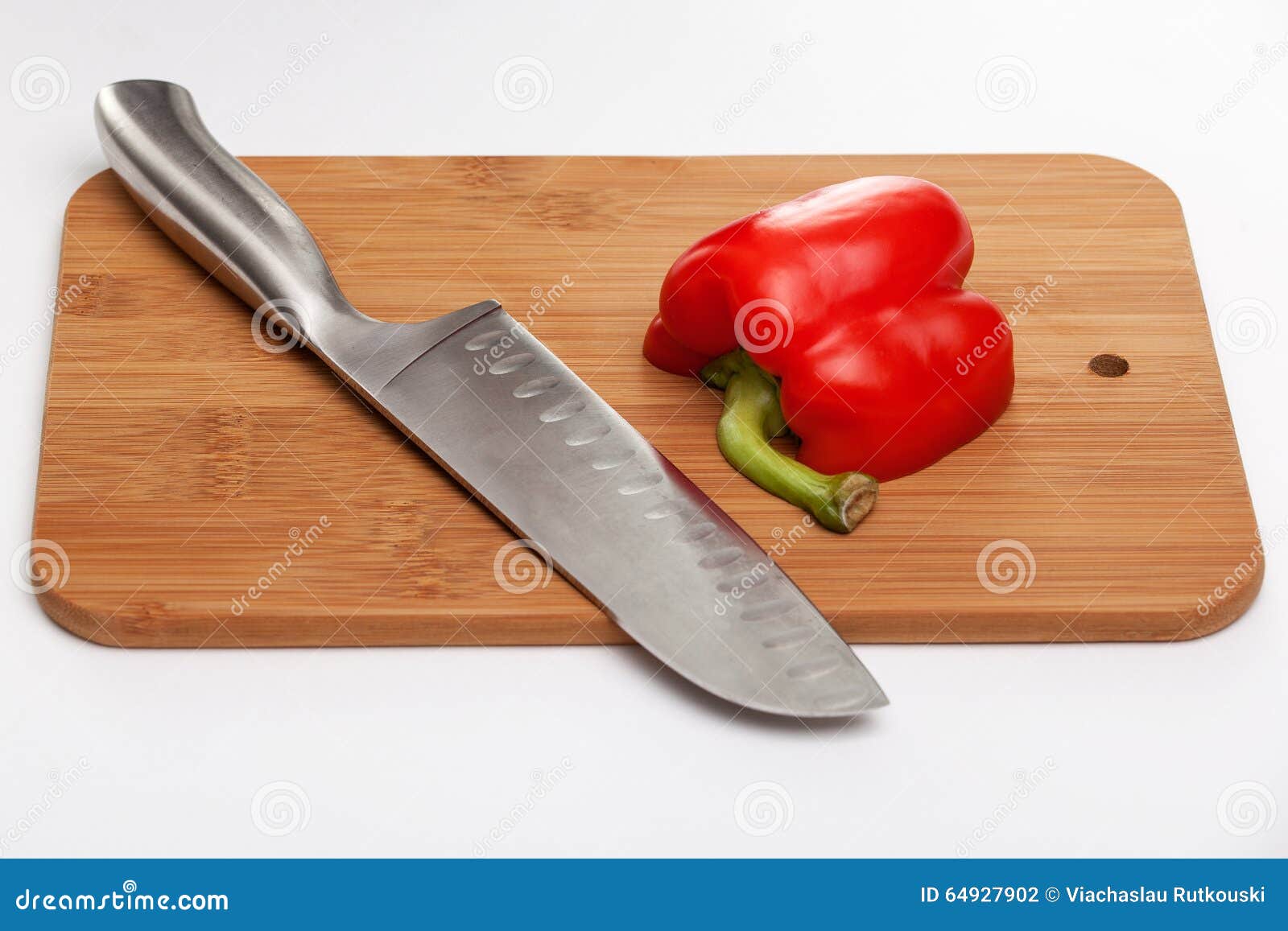 Cutting the Vegetables with a Kitchen Knife on the Board Stock Photo