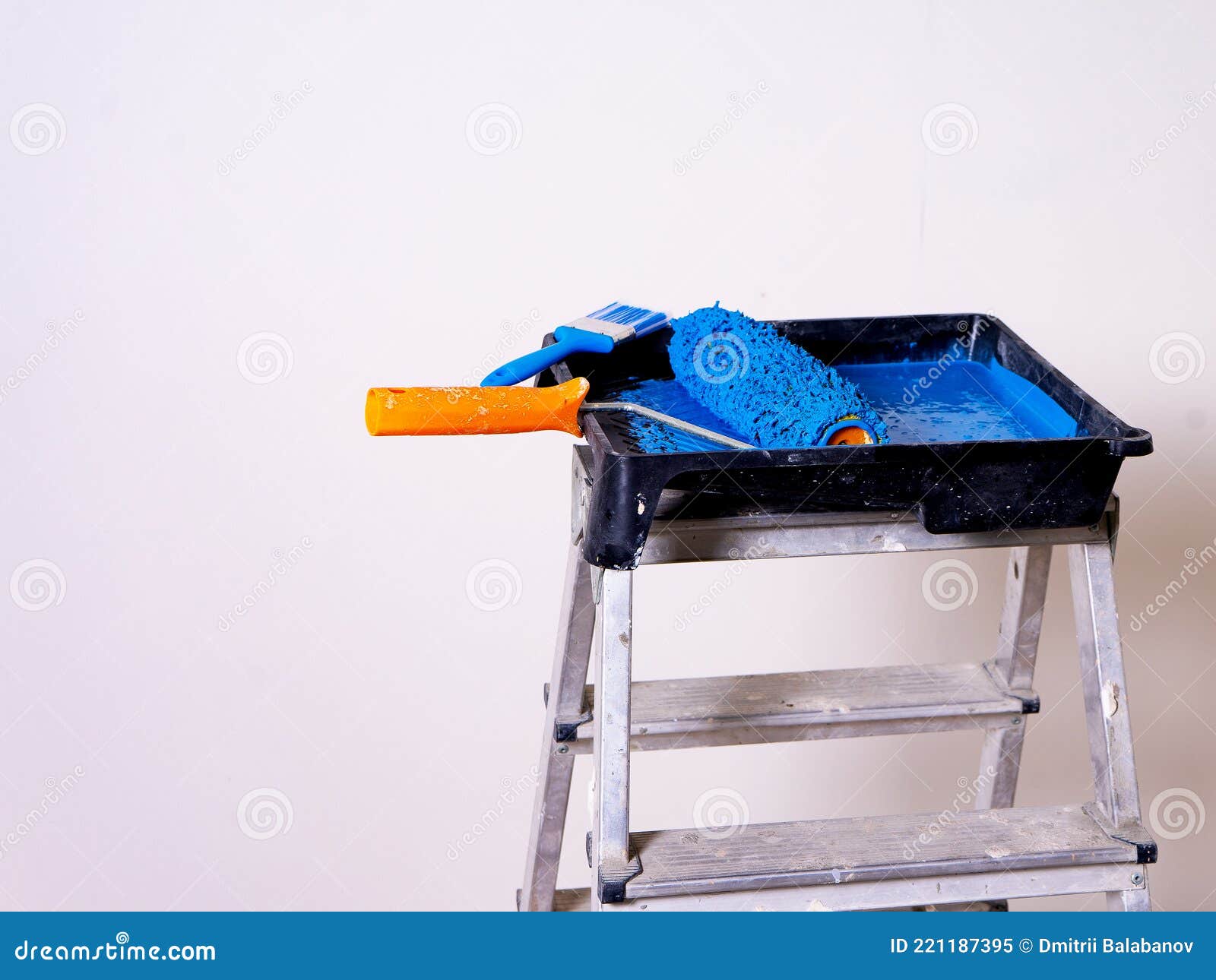 Cuvette for Rollers with a Roller and Brush Filled with Blue Paint