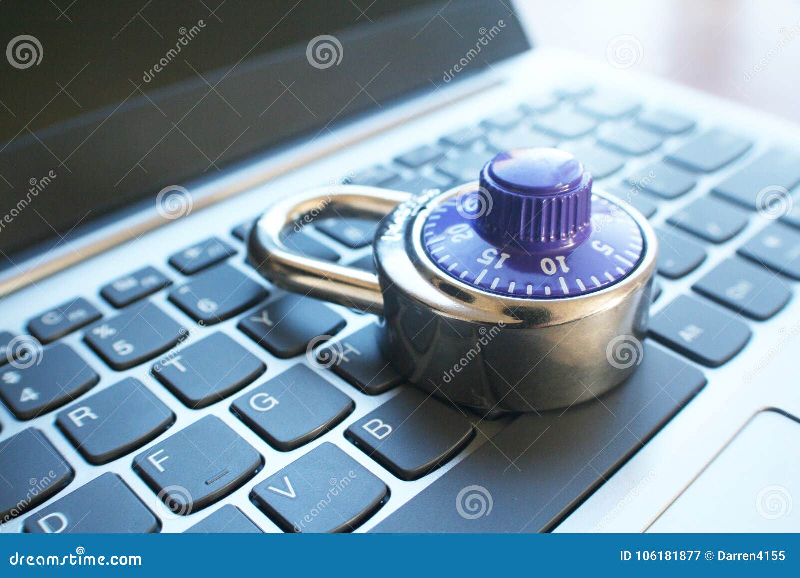 cyber security with blue number dial lock on laptop keyoard high quality