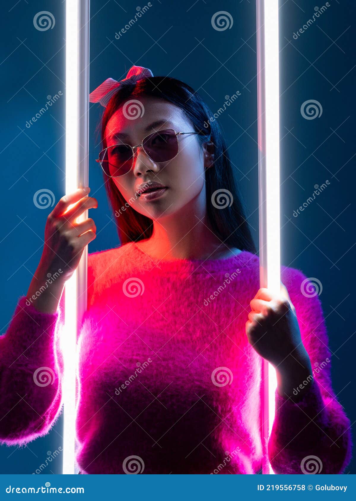 Portrait of a men in a futuristic cyberpunk style in neon clothes. A  high-tech man