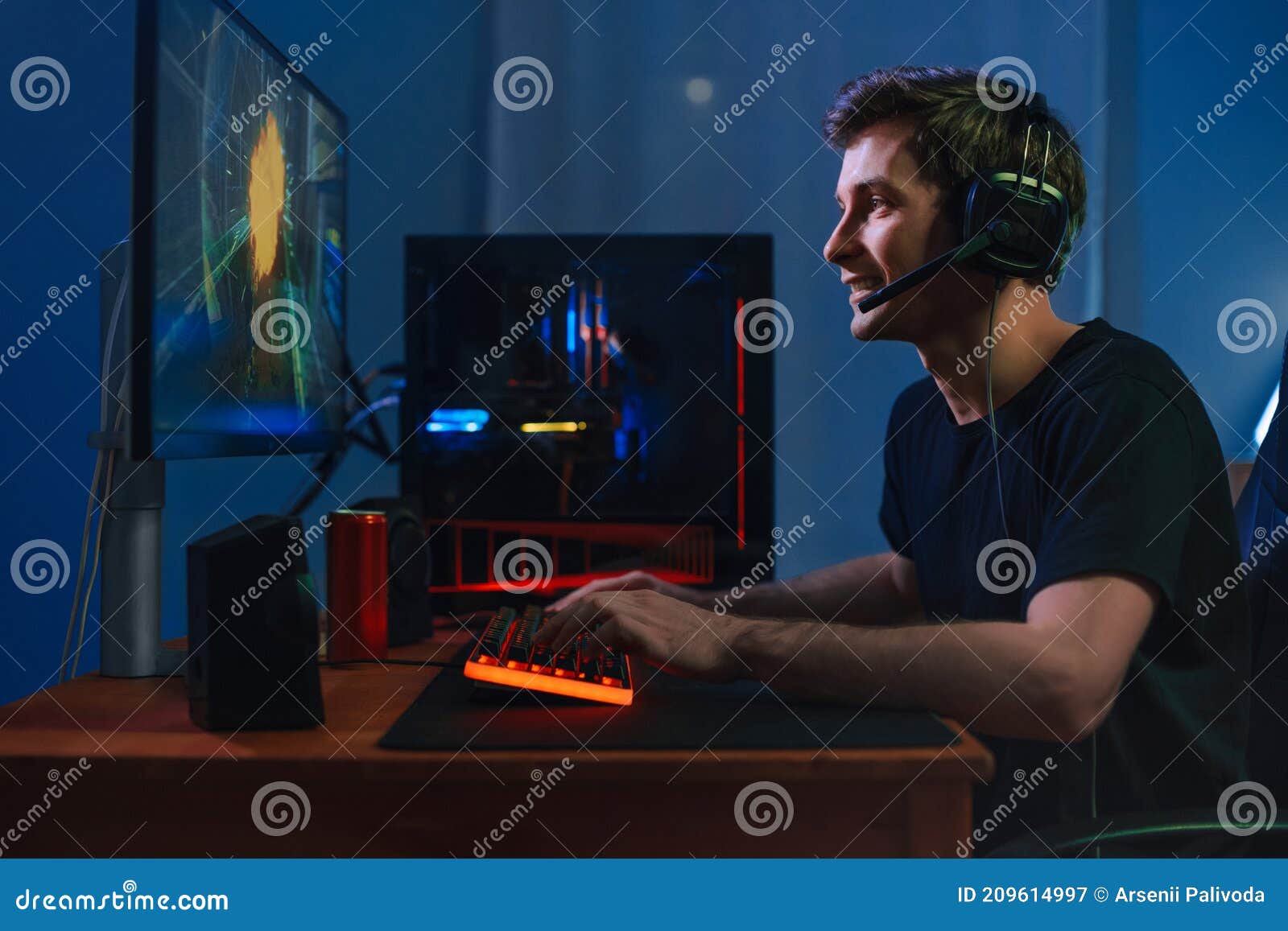 Person playing video games with controller on computer. Player using  joystick and wearing headphones to play online game on monitor. Modern man  using gaming equipment to have fun Stock Photo - Alamy