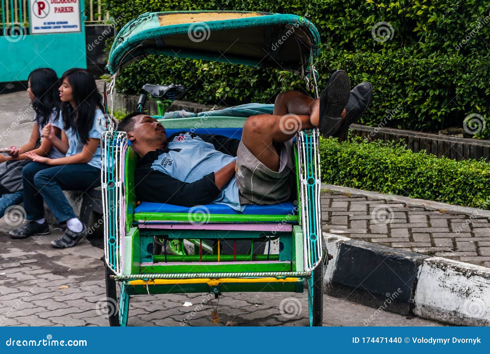 A Trishaw Driver Sleeping In His Cab On The Malioboro ...
