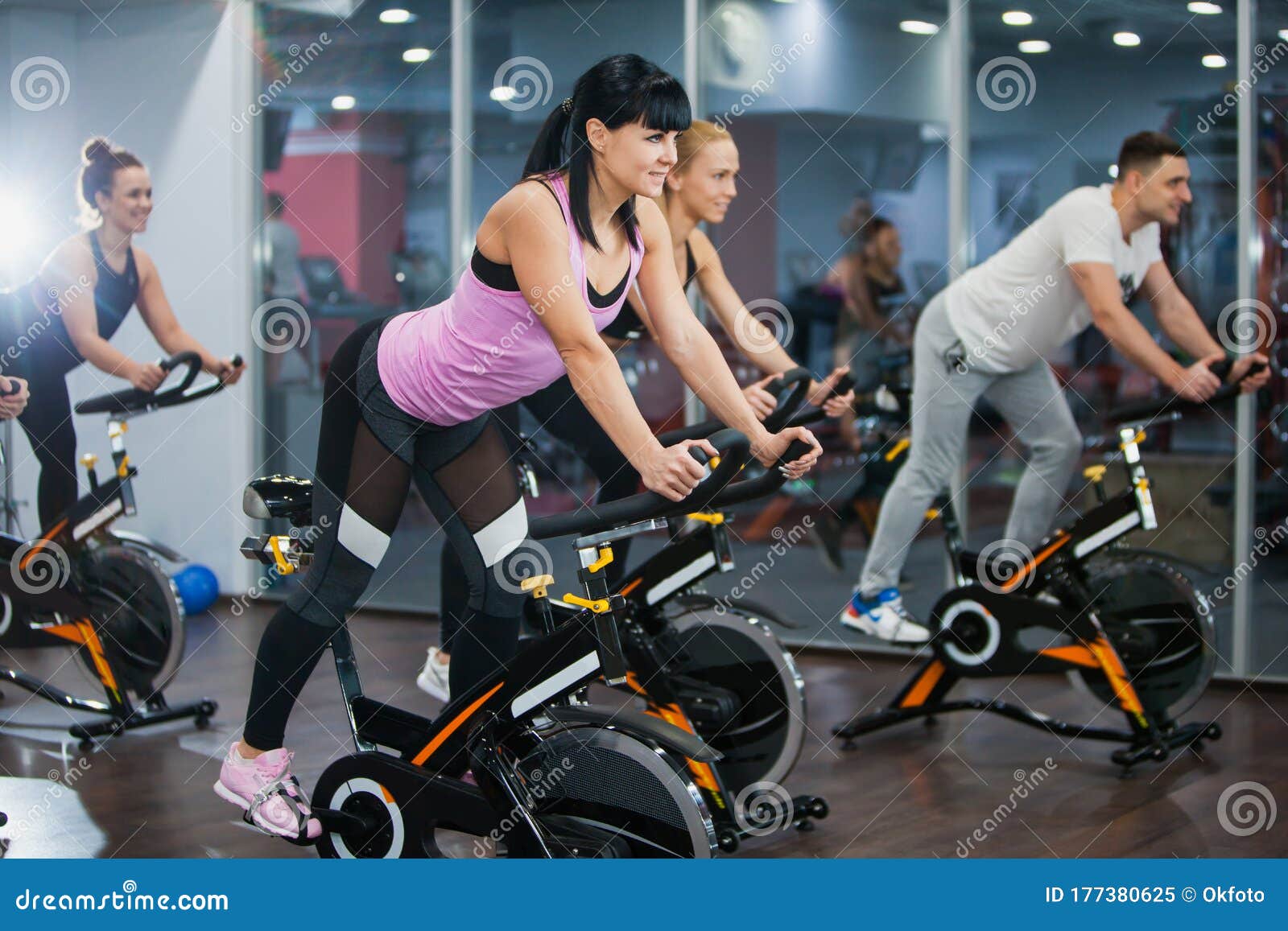 Cycling Class in Fitness Club, Group of Fit People Spinning on Cardio  Machine Stock Image - Image of cardio, exercising: 177380625