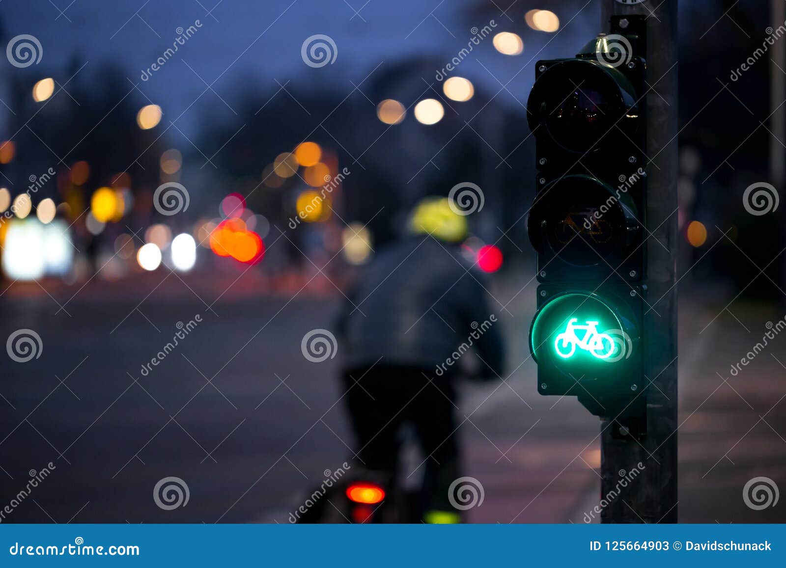 cyclist passes bicycle traffic light