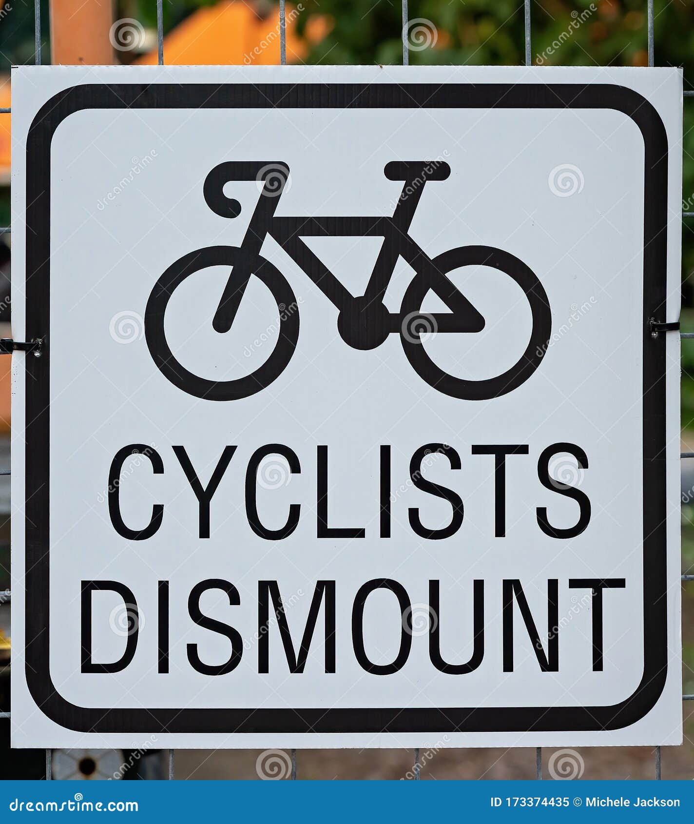 Cyclists please dismount sign 