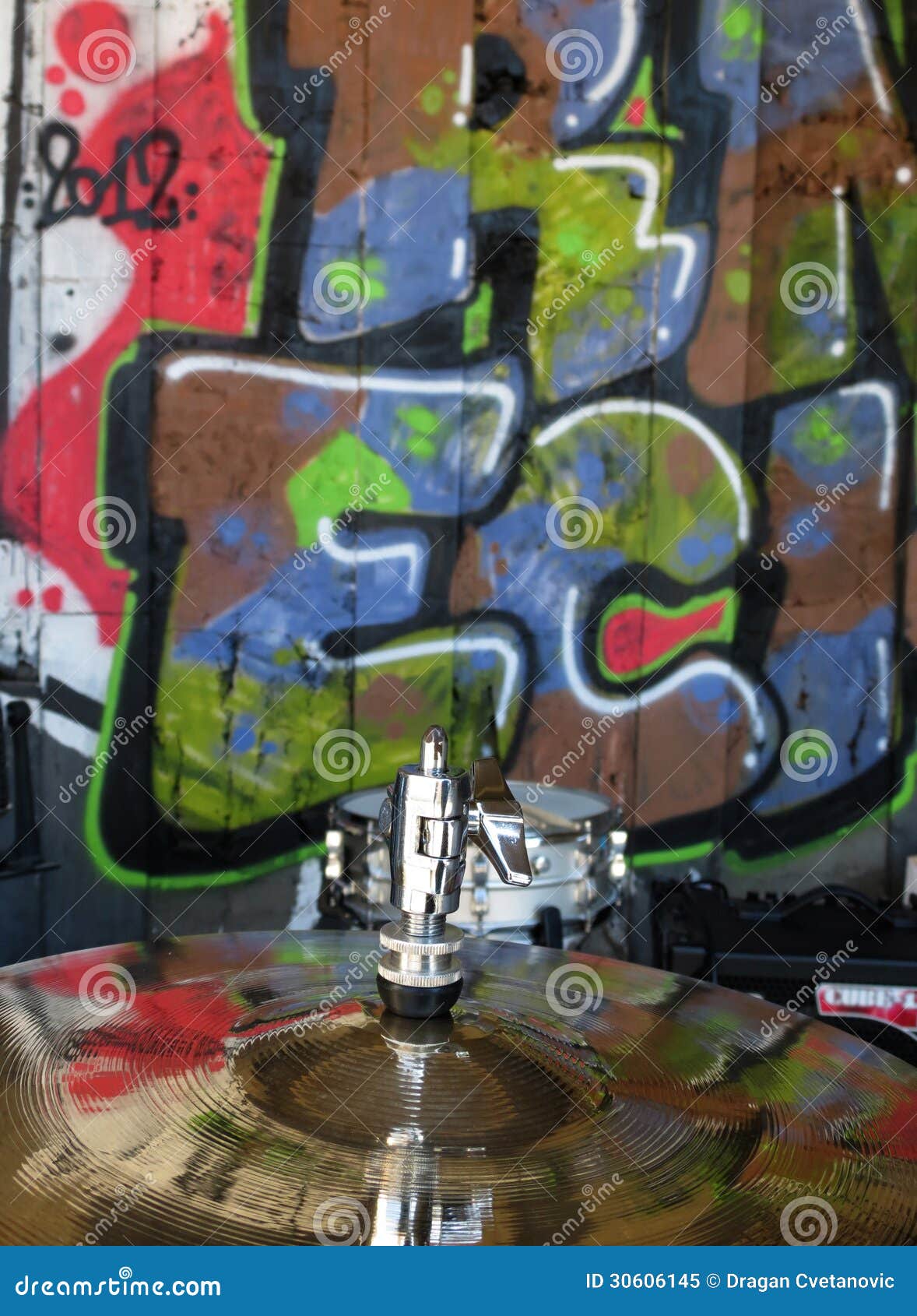 cymbal with graffiti reflection