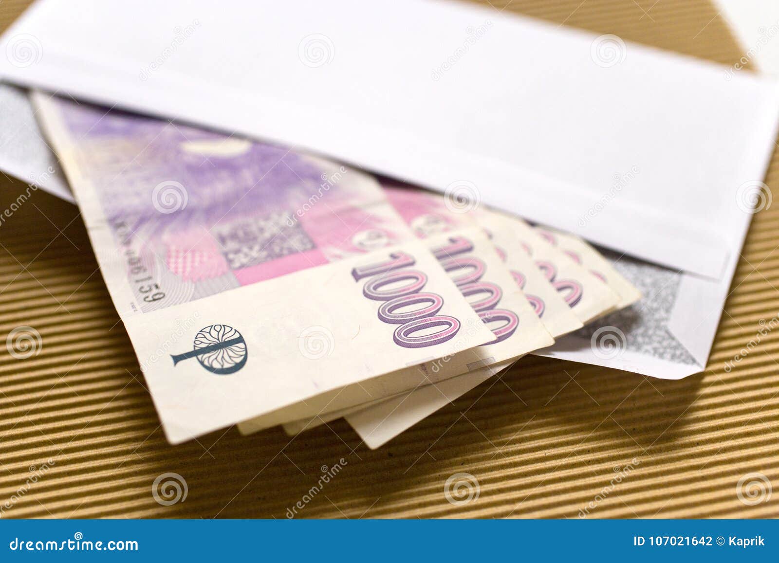 czech economy and finance - czech crown banknotes in a envelope - bribe and corruption