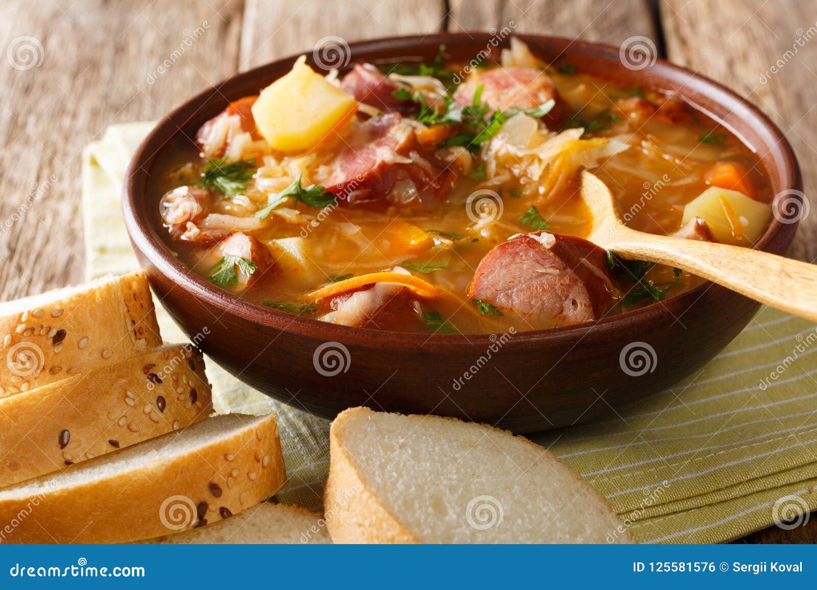 czech food: zelnacka cabbage soup with sausages and vegetables c