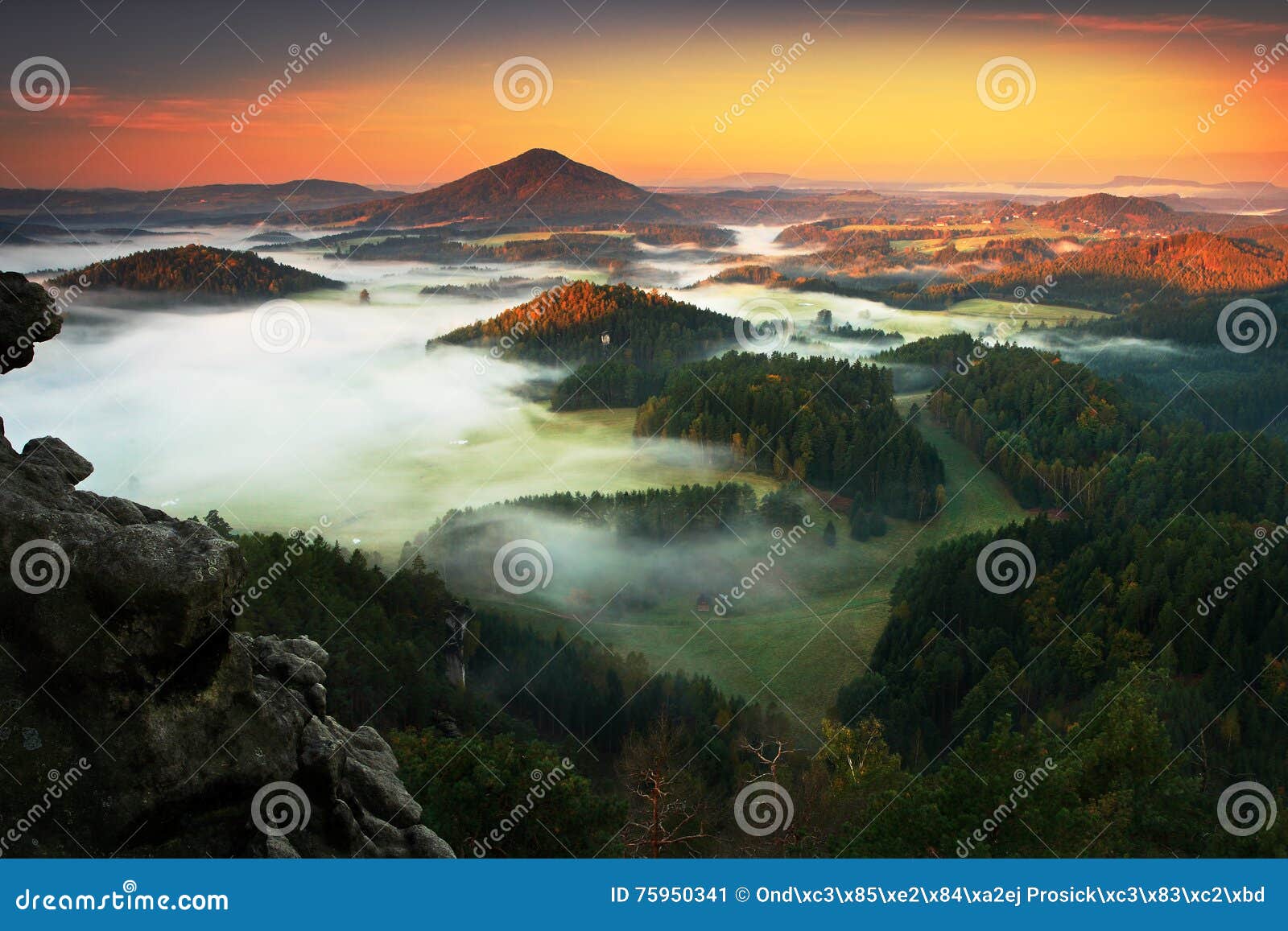 czech typical autumn landscape. hills and villages with foggy morning. morning fall valley of bohemian switzerland park. hills wit