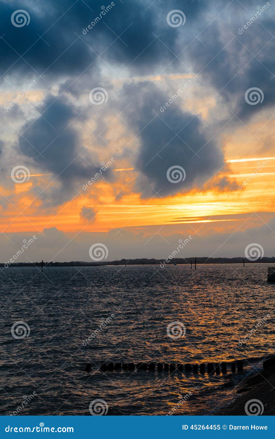 D Day remains sunset. Lepe beach is near Exbury Gardens in Hampshire, used as a loading port for the D Day landings in June 1944. The remains of the makeshift port can still be seen decaying into the sea.