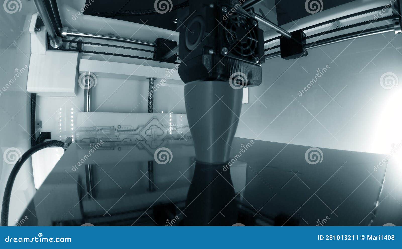 3d printer. 3d printer printing close-up. molten plastic flowing out of extruder