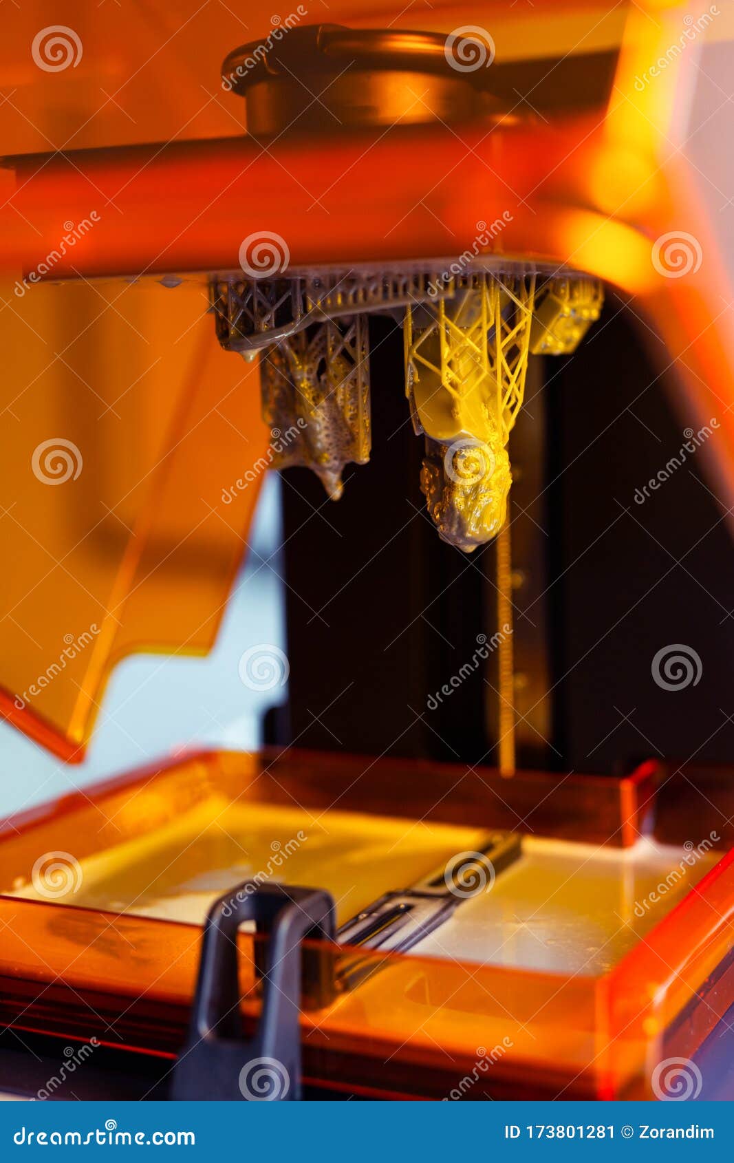 3d printing process. 3d printer for sla stereolithography printing using photopolymer resin.