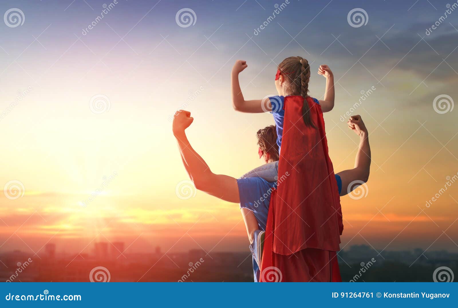 dad and his daughter playing outdoors