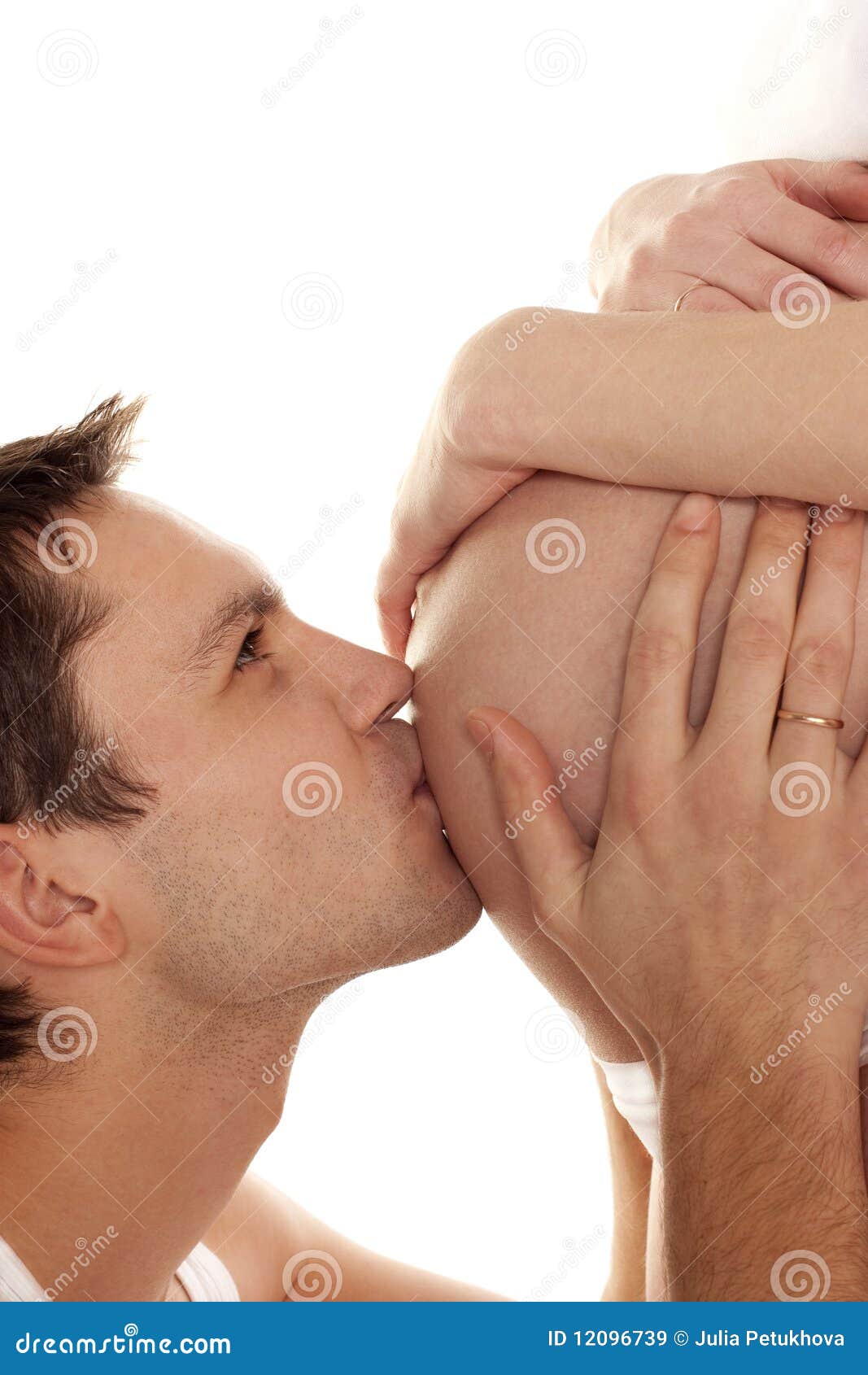 Dad kissing wife s belly stock image photo