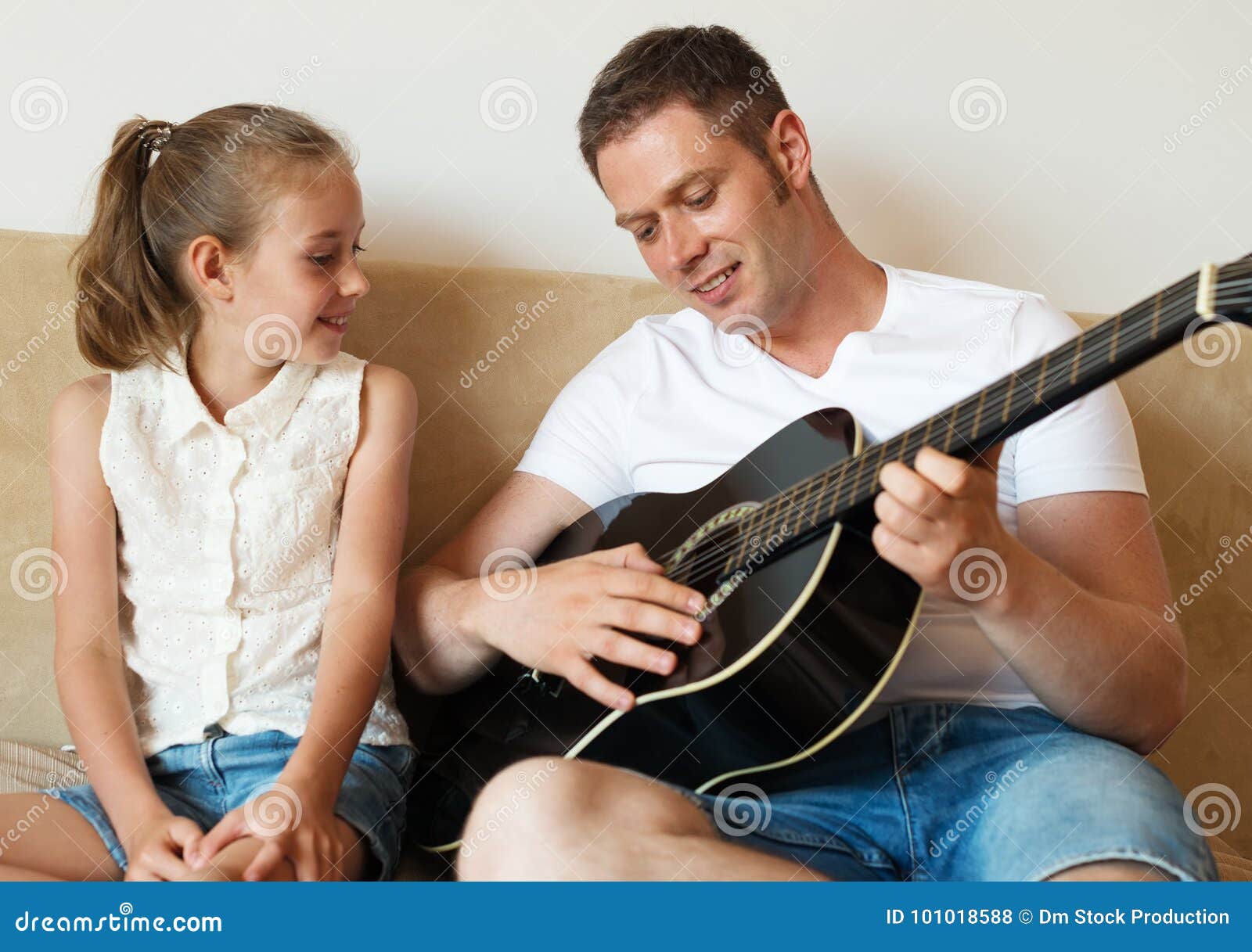 Dad plays the guitar. stock photo. Image of guitar, female 101018588